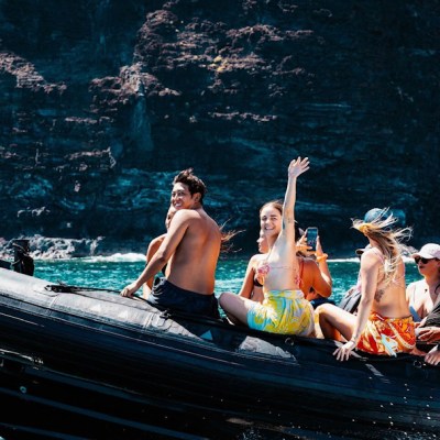 a group of people on a boat in the water