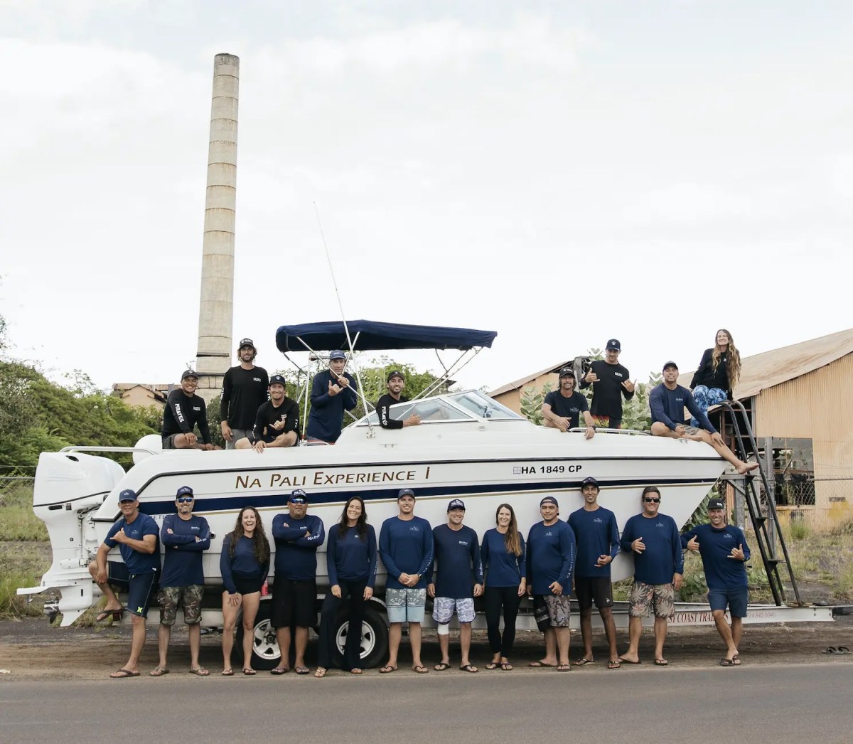 a group of people standing in a parking lot